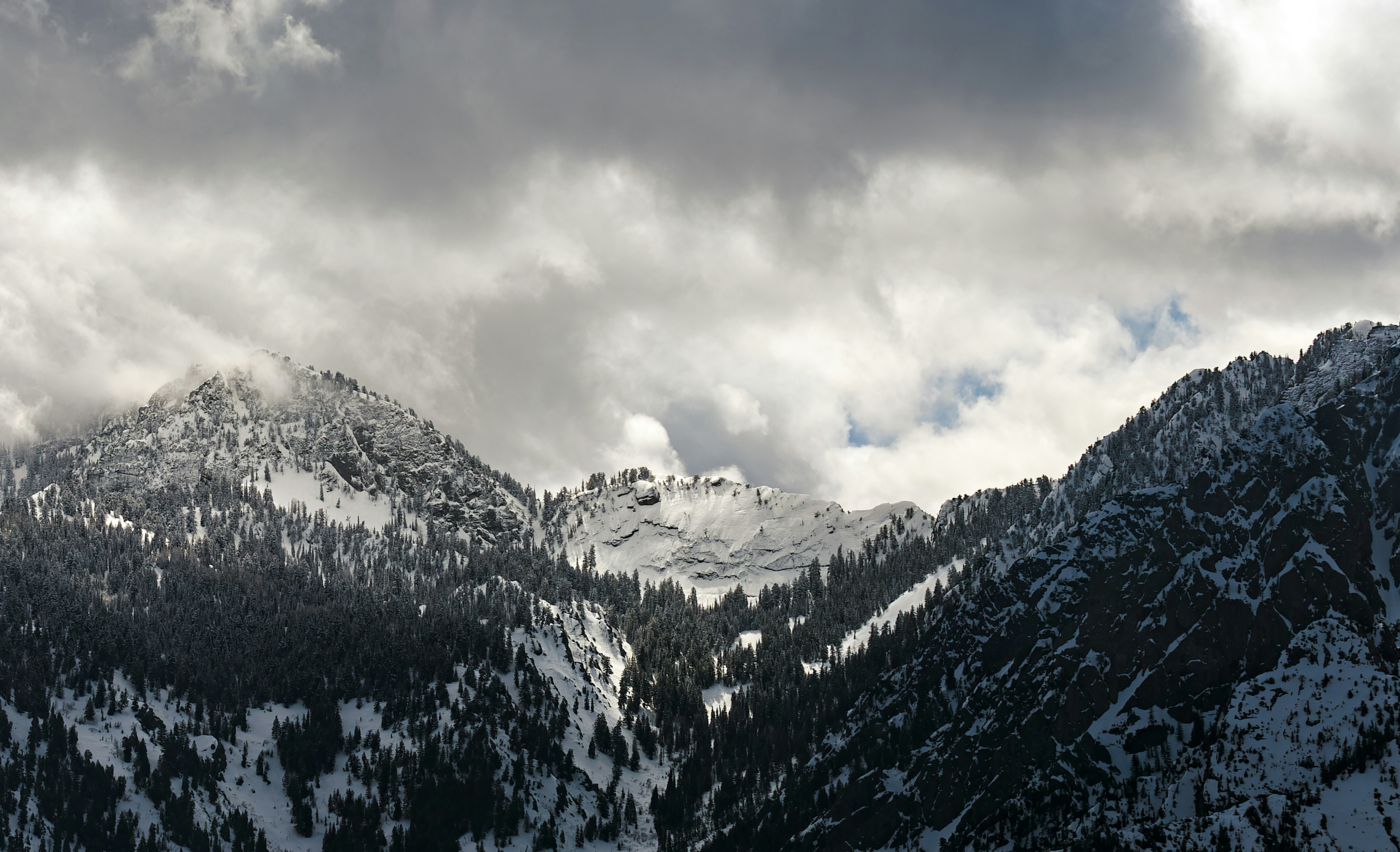 A mountain covered in snow under a cloudy sky photo – Free Wallpaper ...