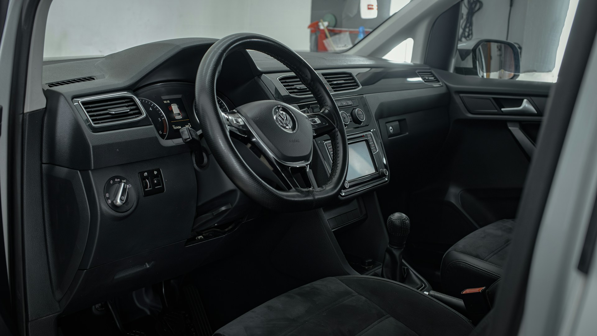 the interior of a vehicle with a steering wheel and dashboard