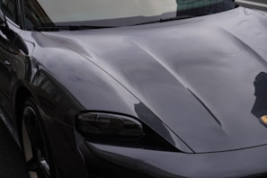 a black sports car parked on the side of the road