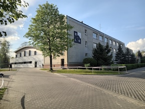 a building with a parking lot in front of it