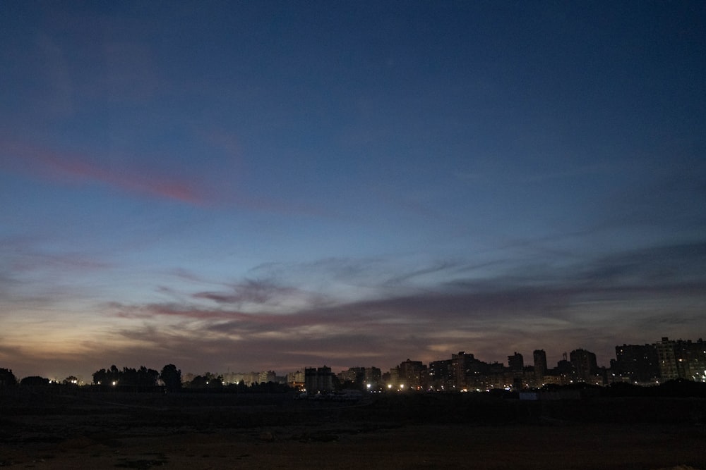 a view of a city at night from a beach