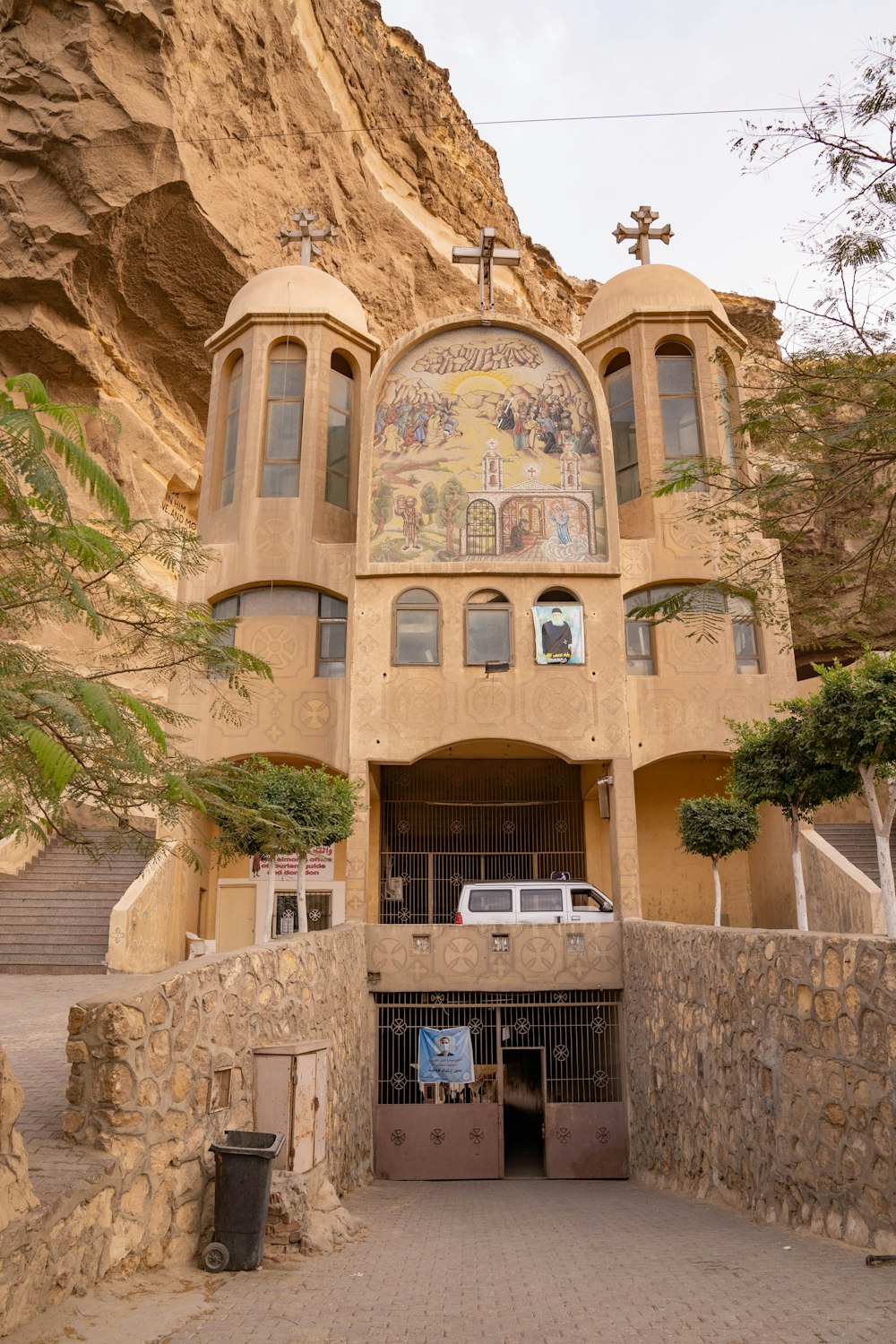 a large building with a cross on top of it