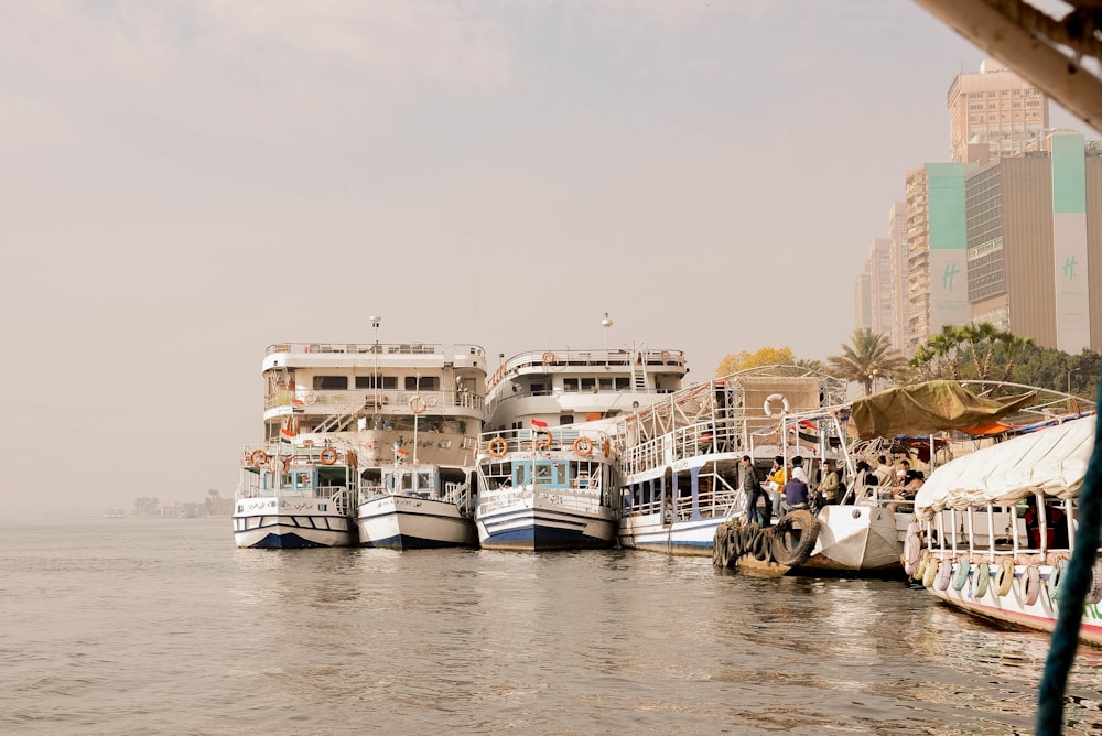 a group of boats that are sitting in the water