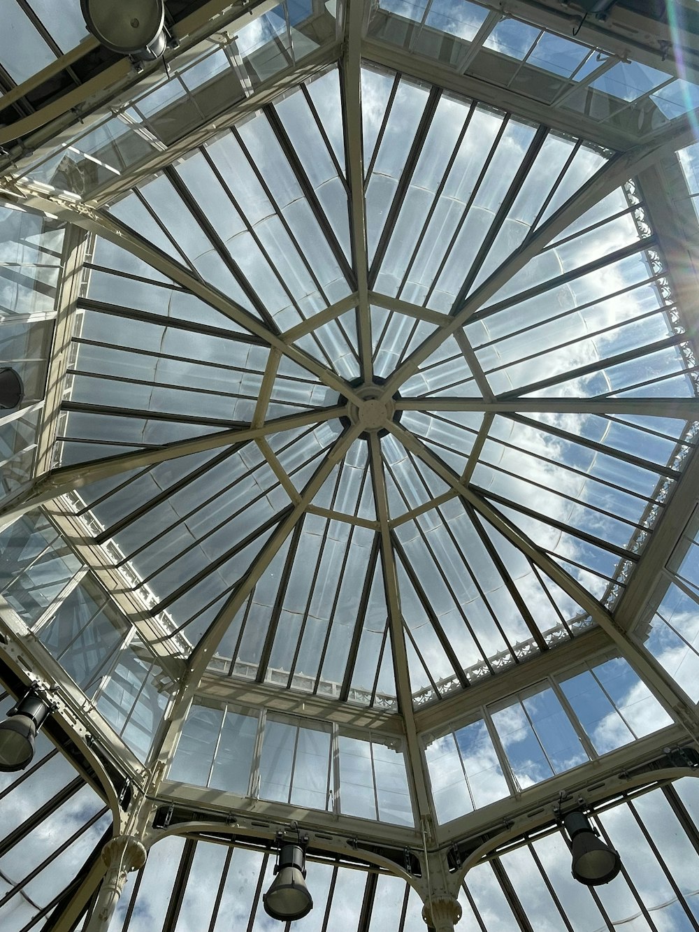 a glass ceiling with a skylight inside of it