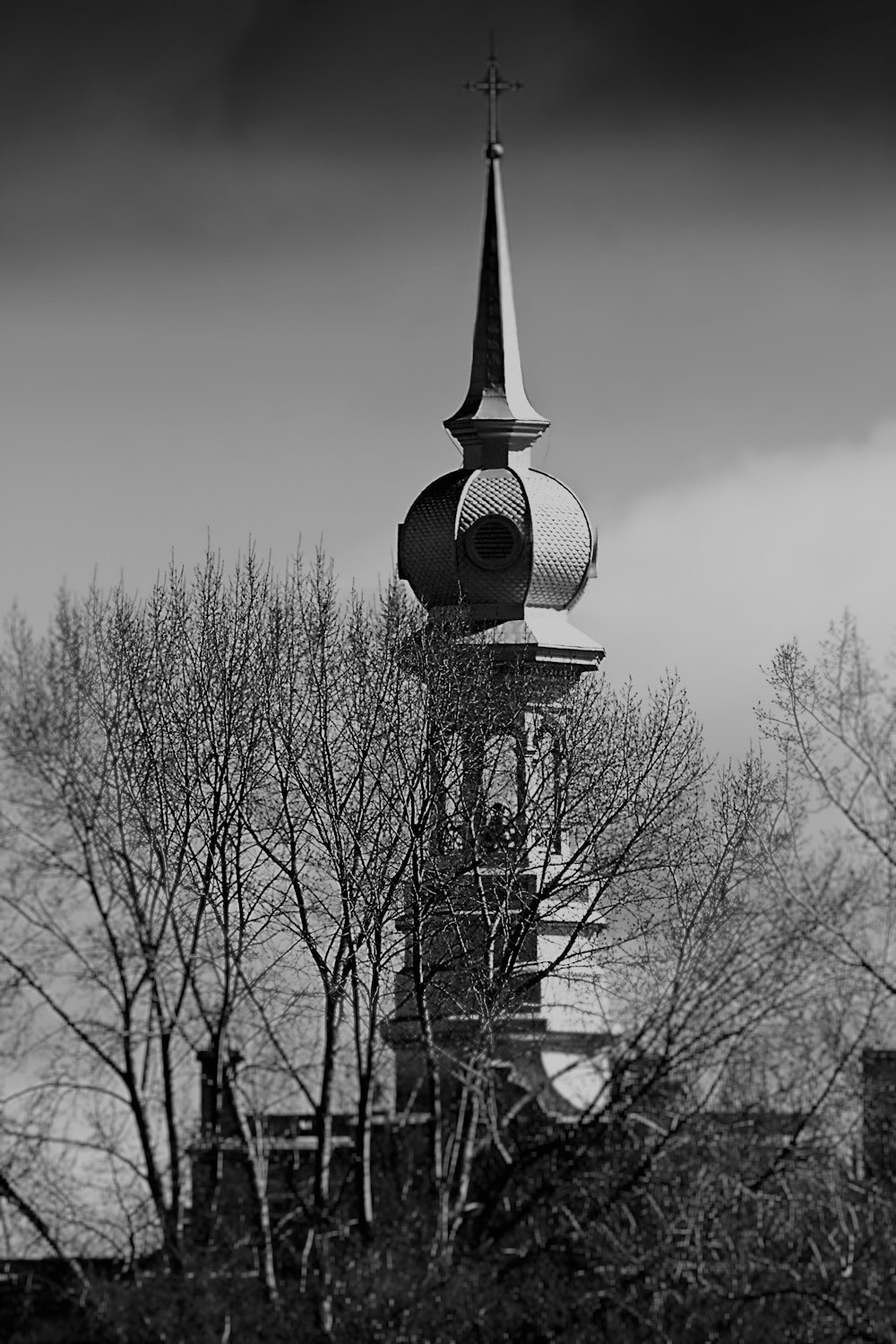 a black and white photo of a clock tower