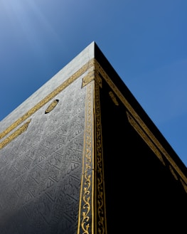 the top of a tall building with a sky background