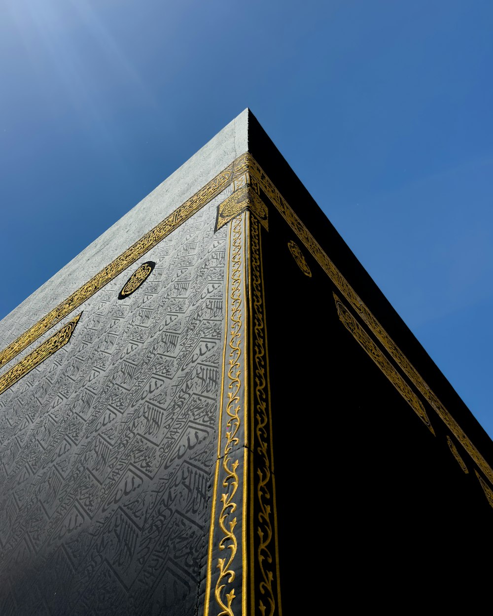 the top of a tall building with a sky background