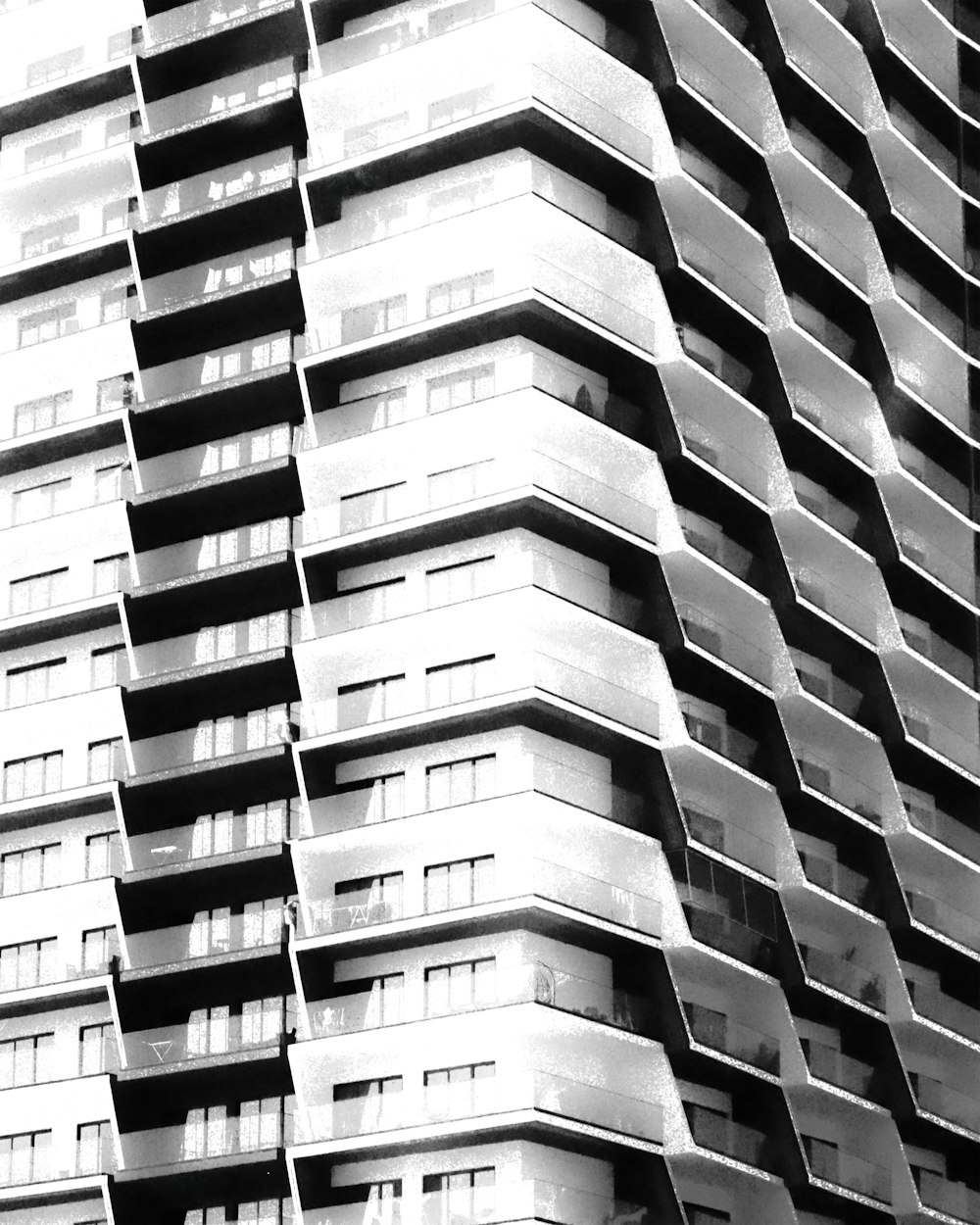 a black and white photo of a tall building