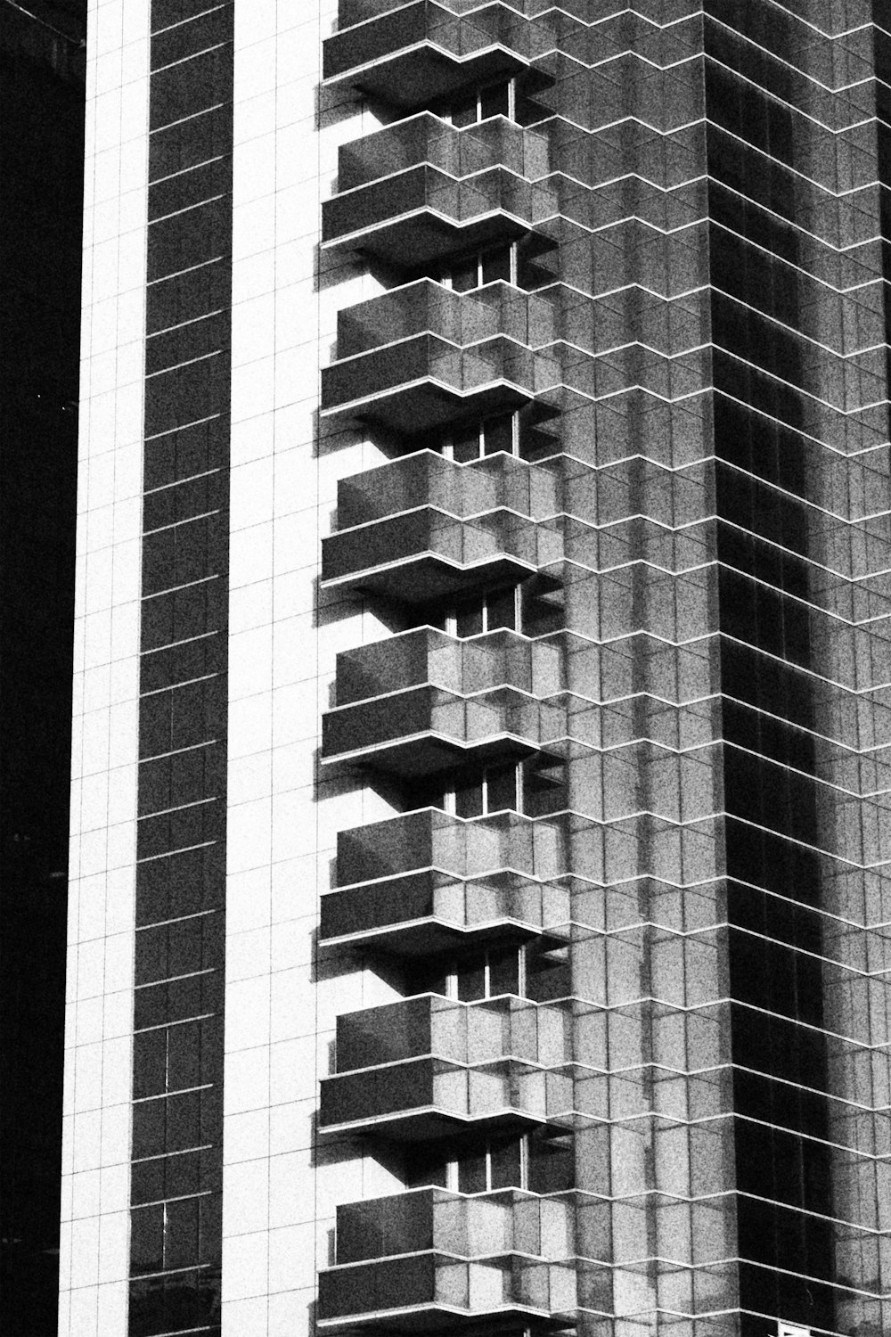 a black and white photo of a tall building