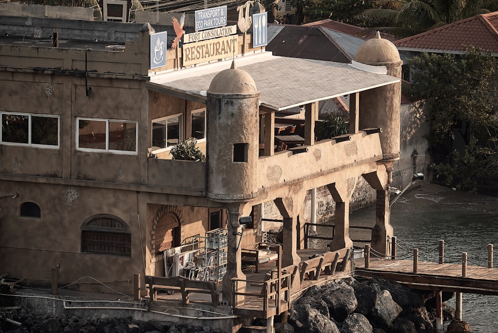 an old building with a balcony and a roof