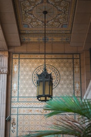 a lamp hanging from the ceiling of a building
