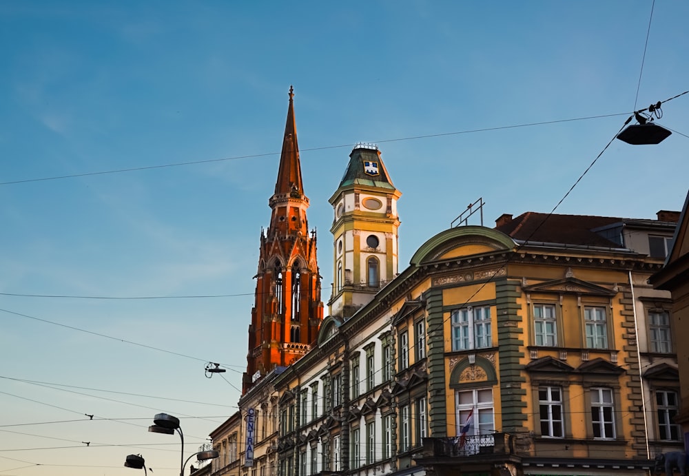 a church steeple towering over a city street