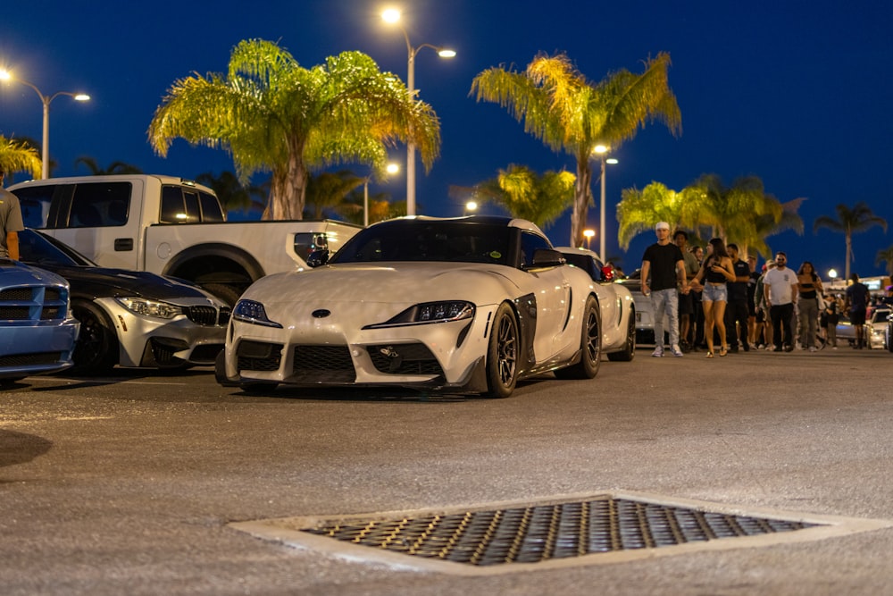 a group of cars parked next to each other in a parking lot