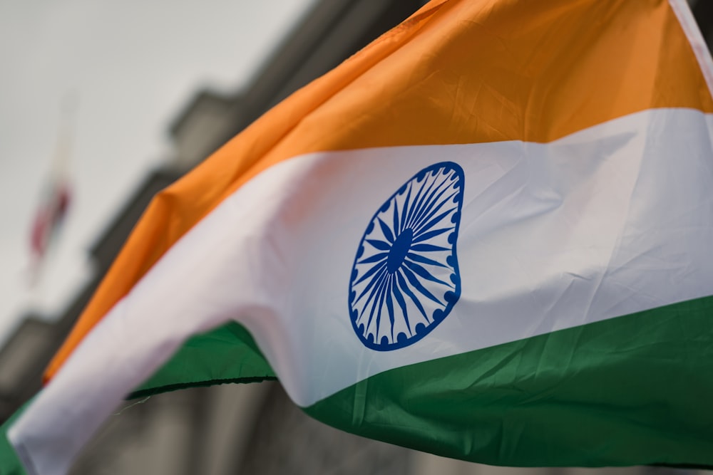 the indian flag is flying in the wind
