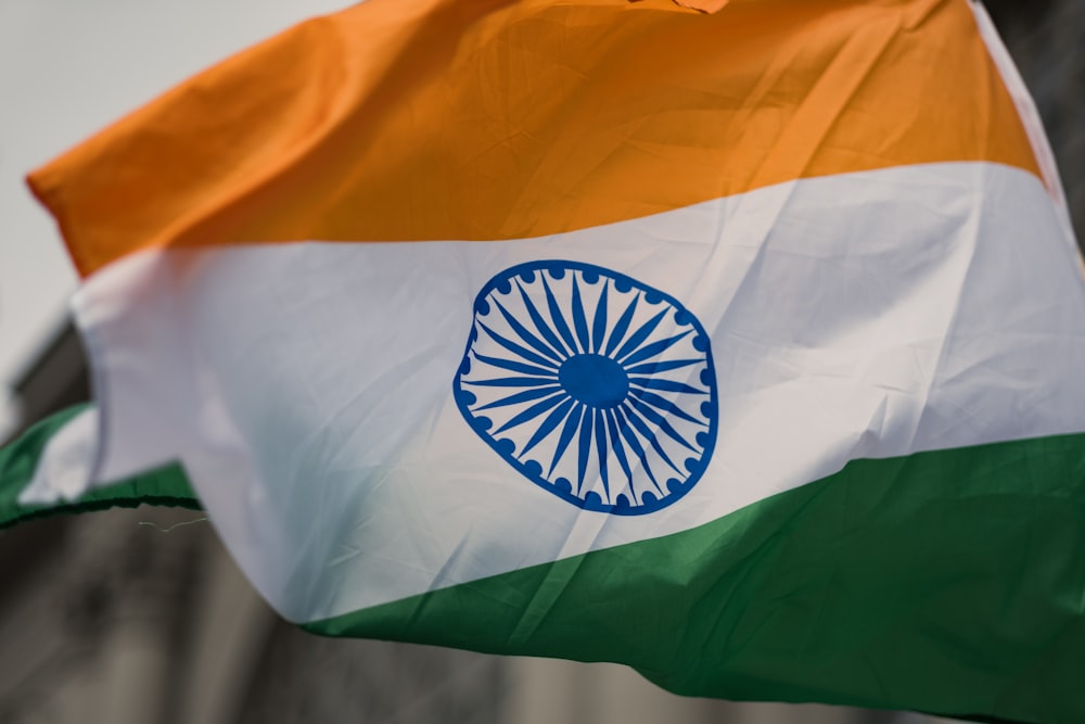 the indian flag is flying in the wind