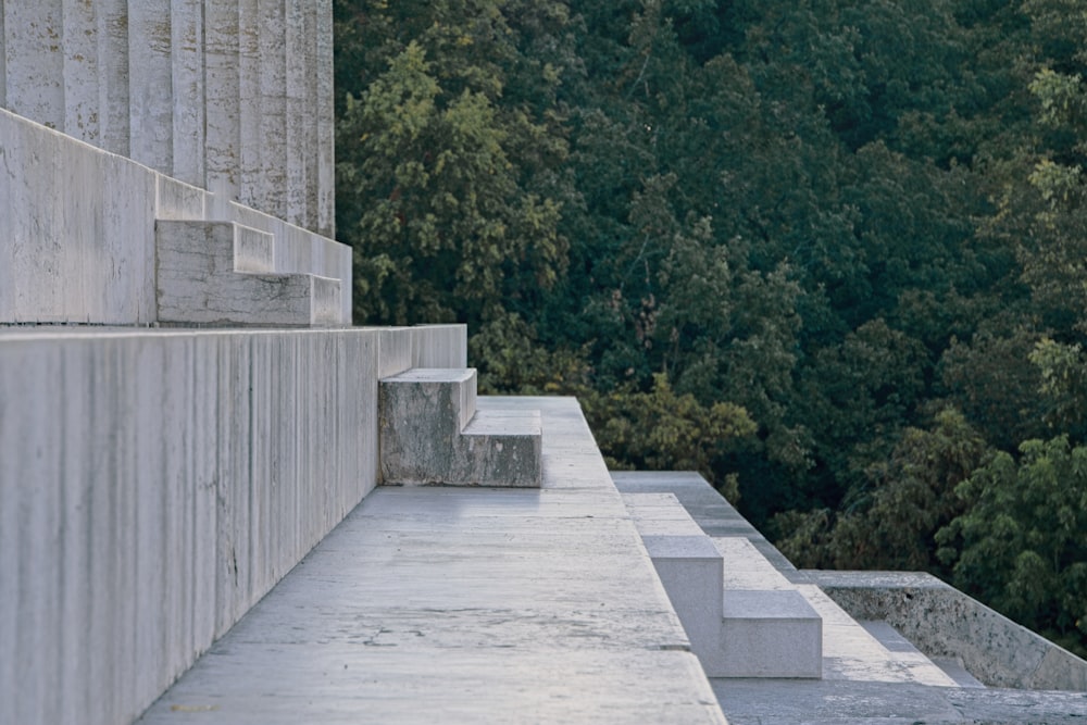 a man riding a skateboard down the side of a cement wall