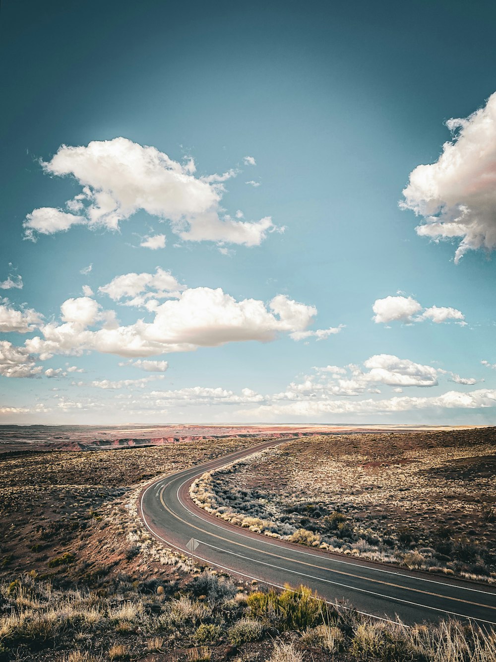 an empty road in the middle of nowhere