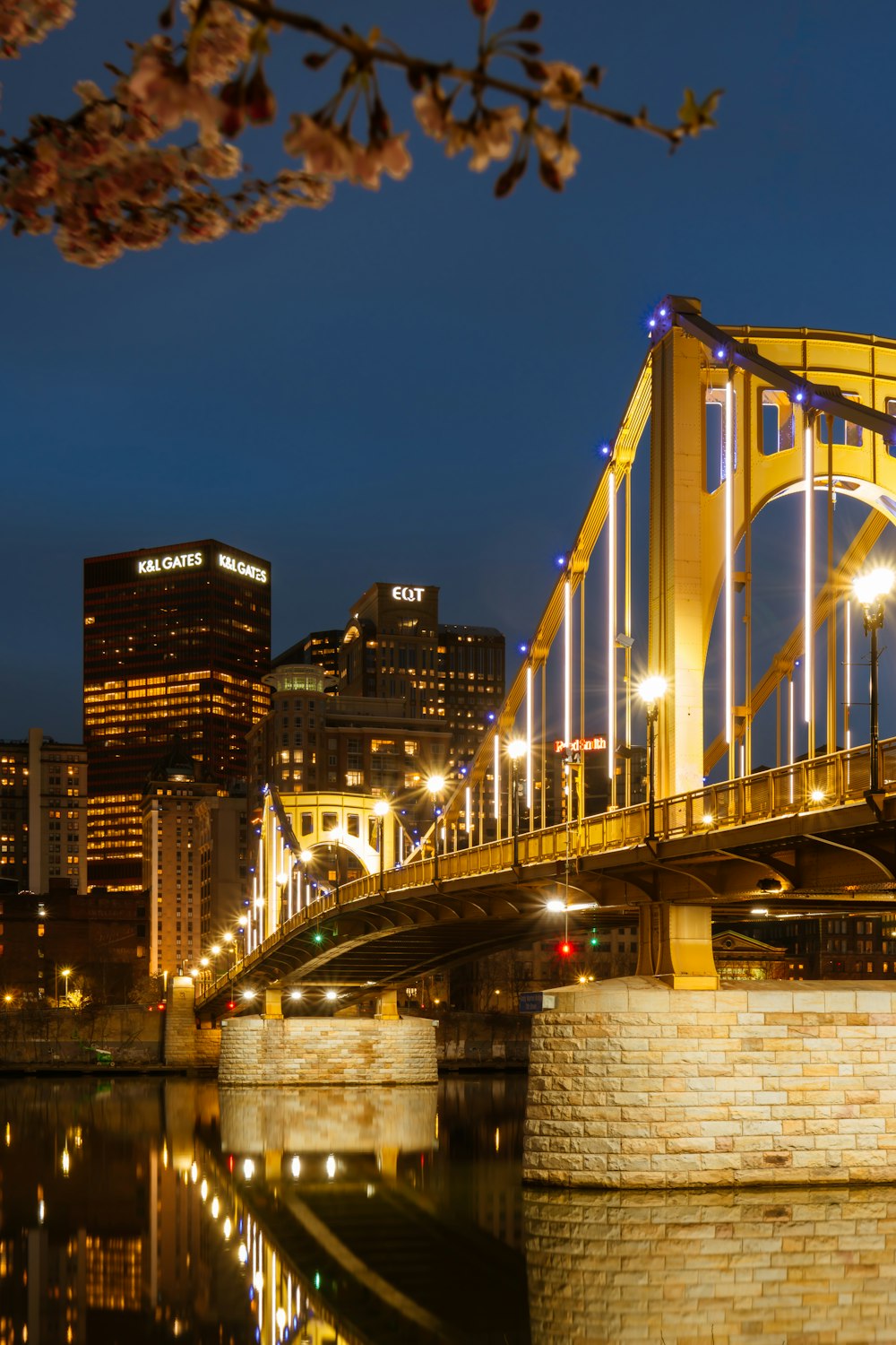 a bridge over a body of water at night