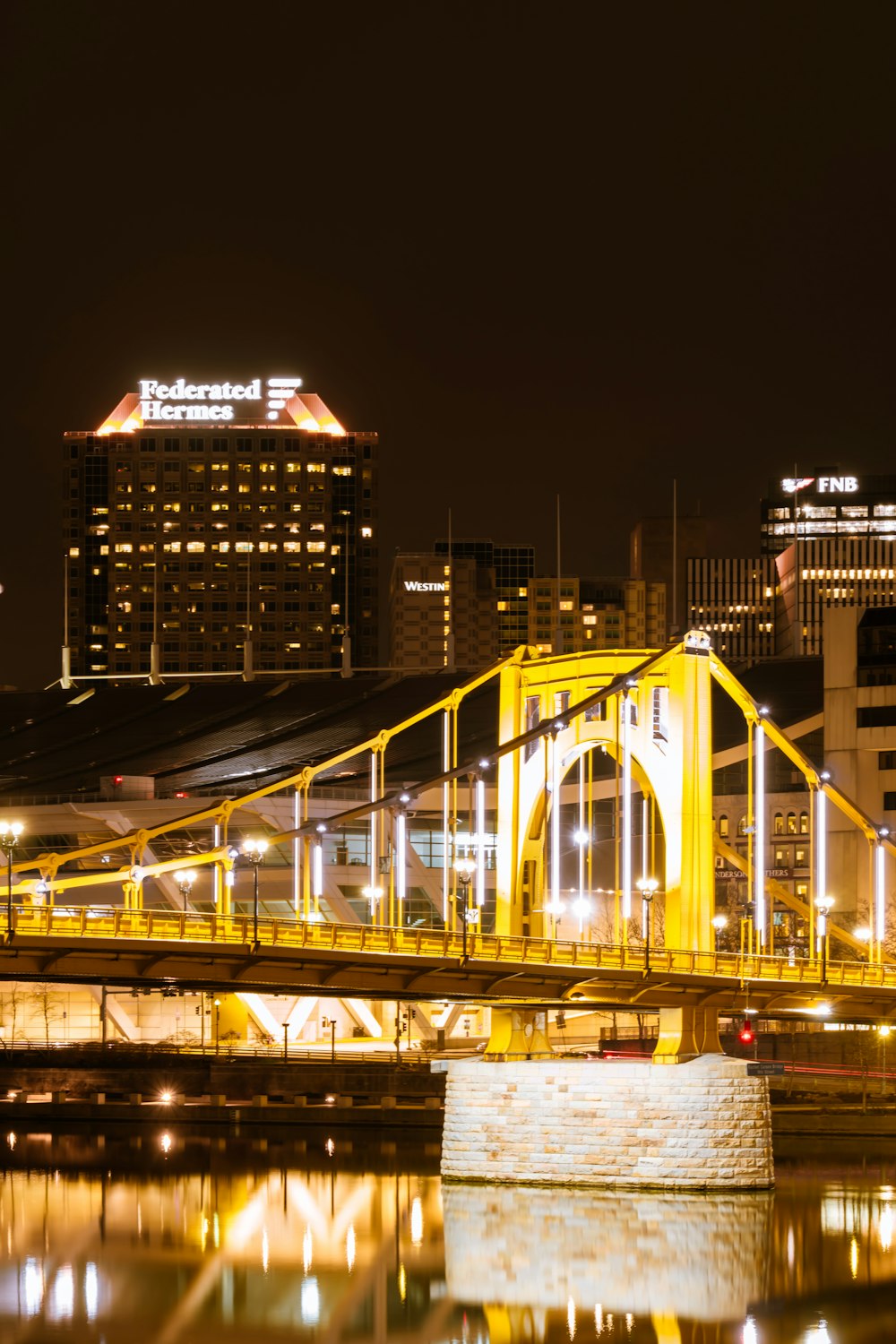 a bridge over a body of water at night