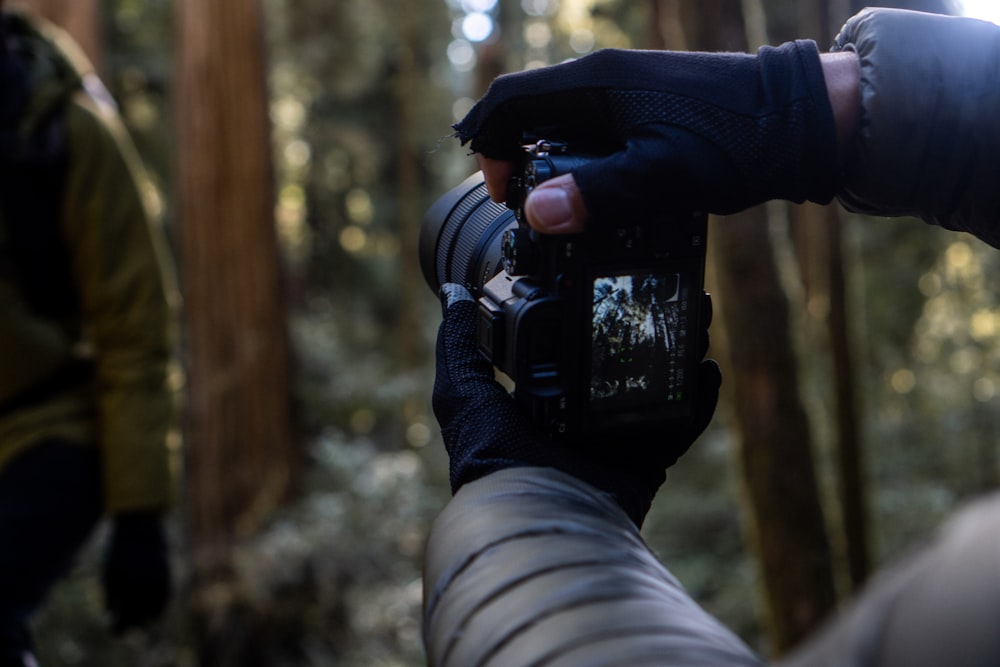 a person holding a camera up to take a picture