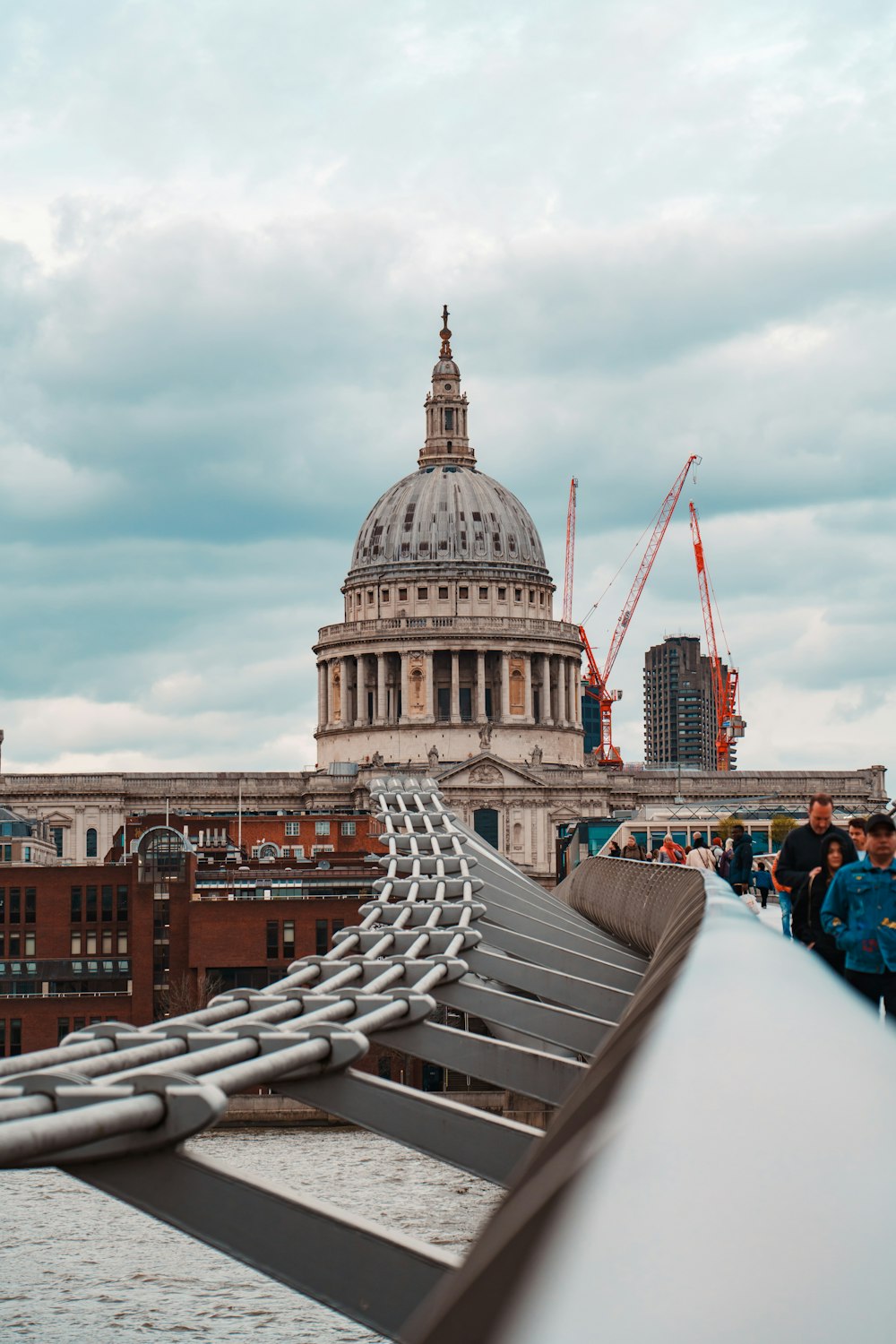 a view of the dome of st paul's cathedral from a bridge