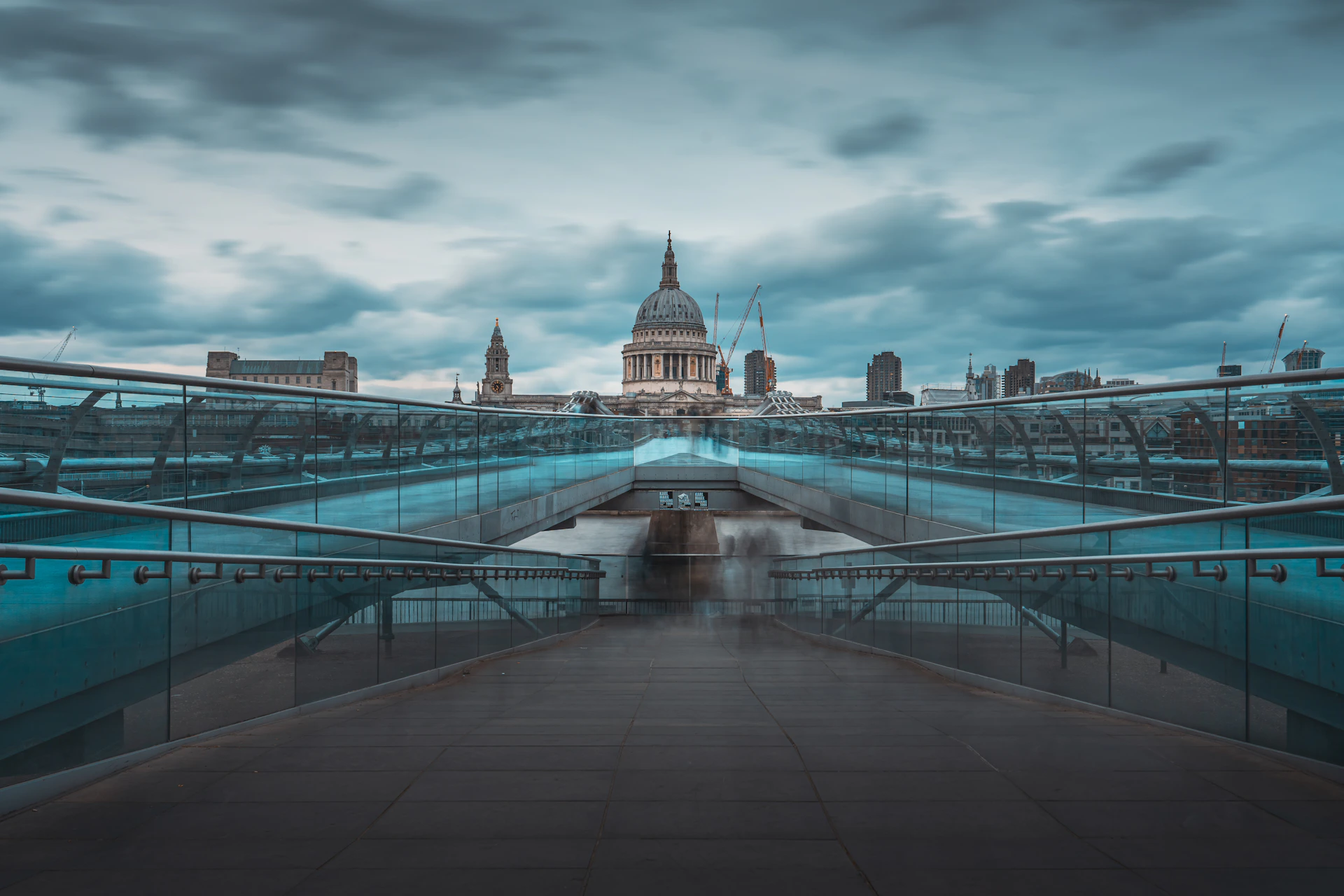 a view of a bridge with a building in the background