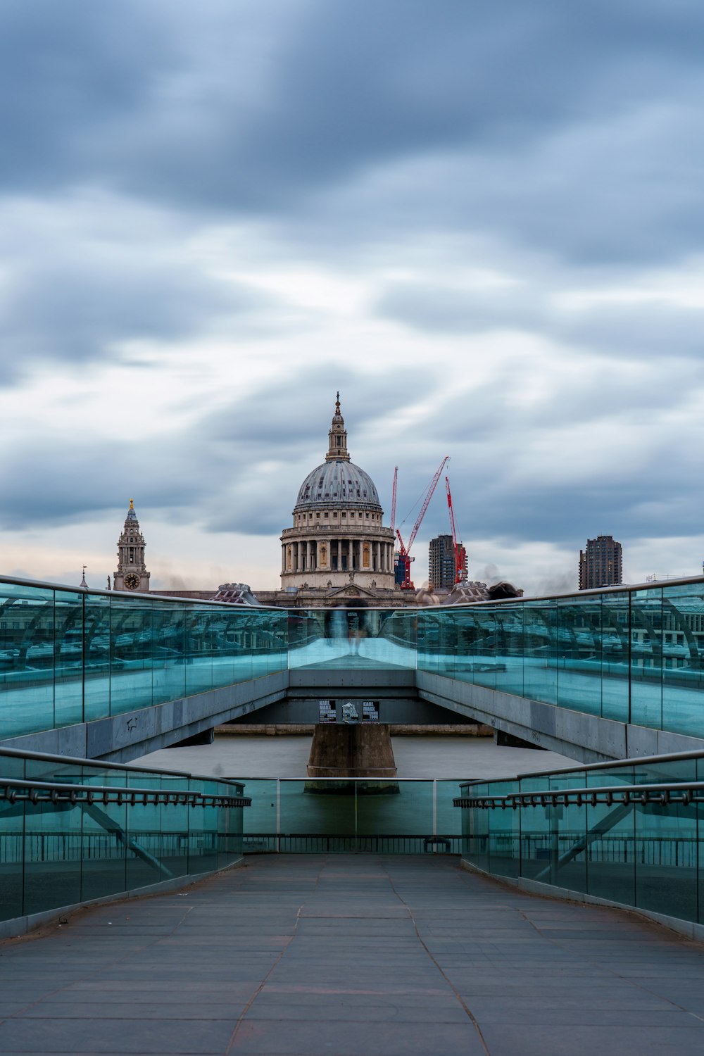 a bridge with a view of the dome of st paul's cathedral in the