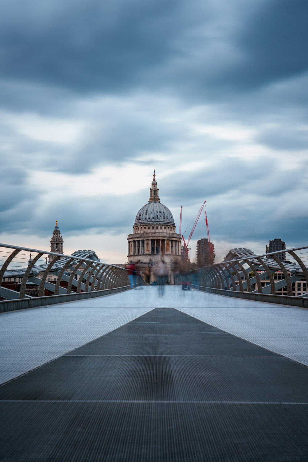 a view of a bridge with a building in the background