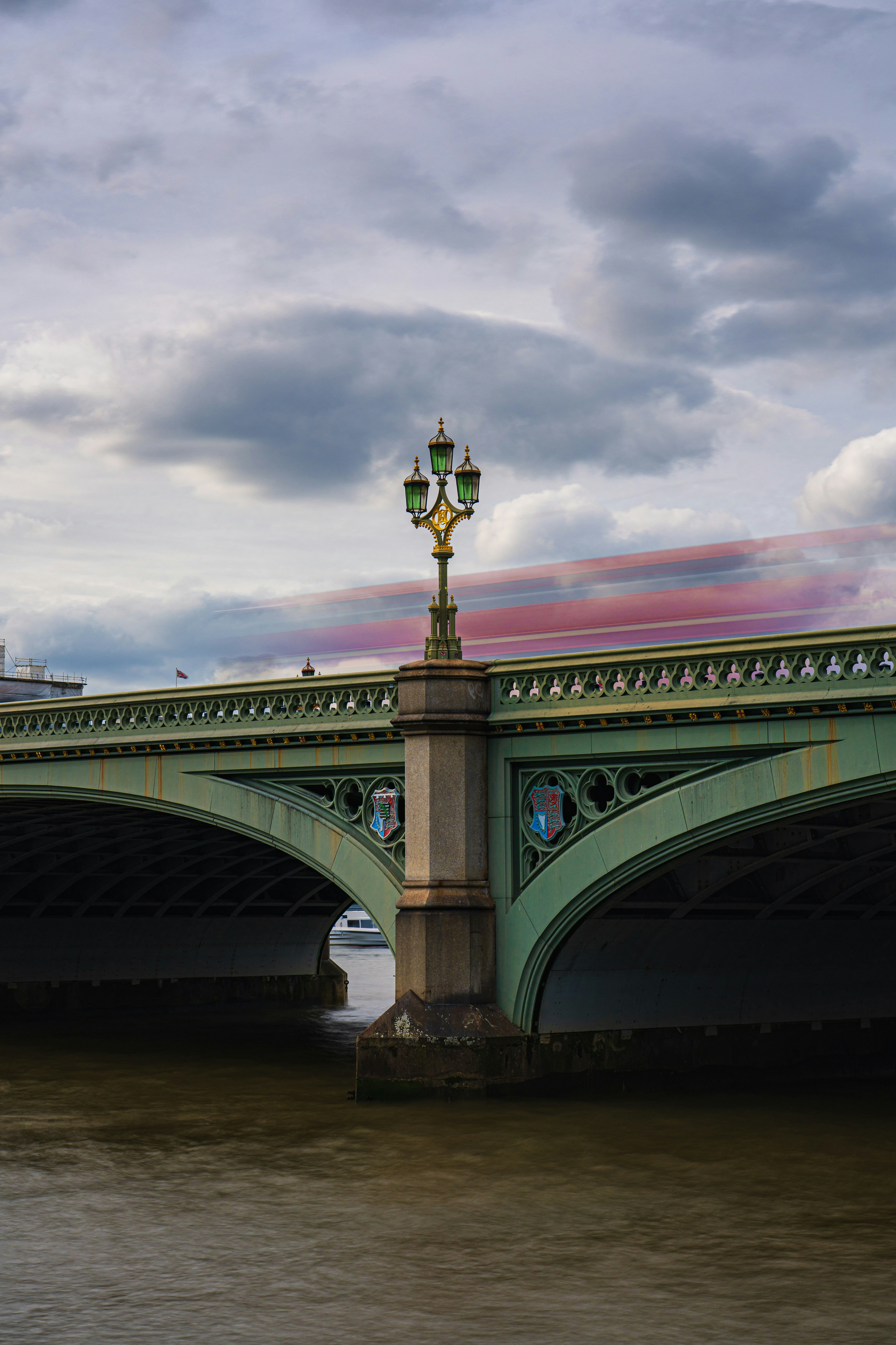 a bridge that has a street light on top of it