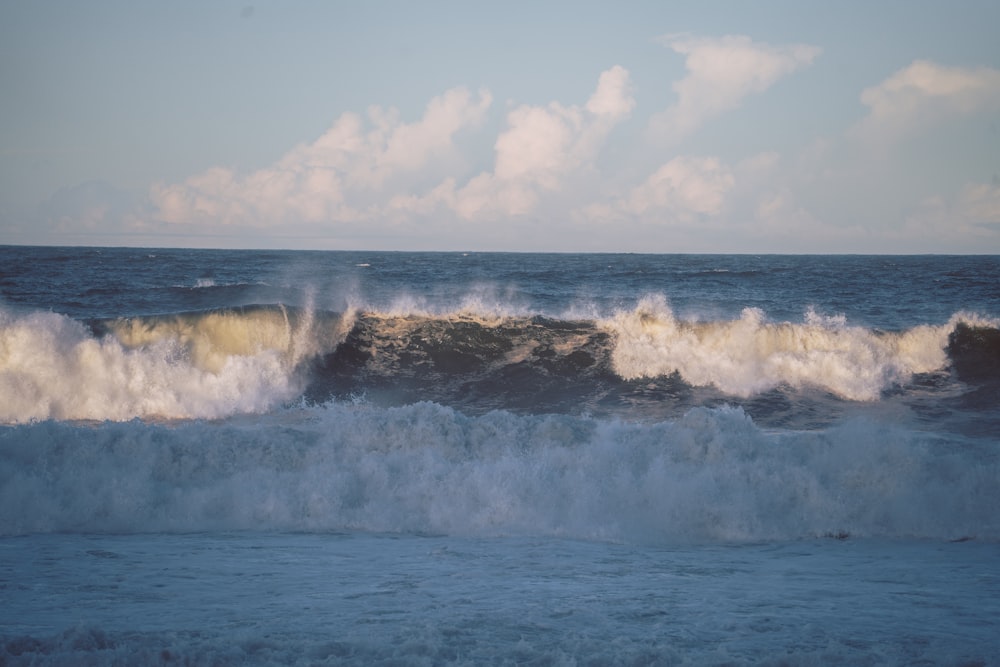 a large body of water with waves coming in