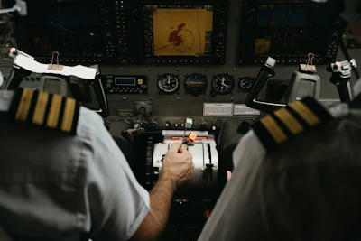 Two pilots in the cockpit of a commercial aircraft