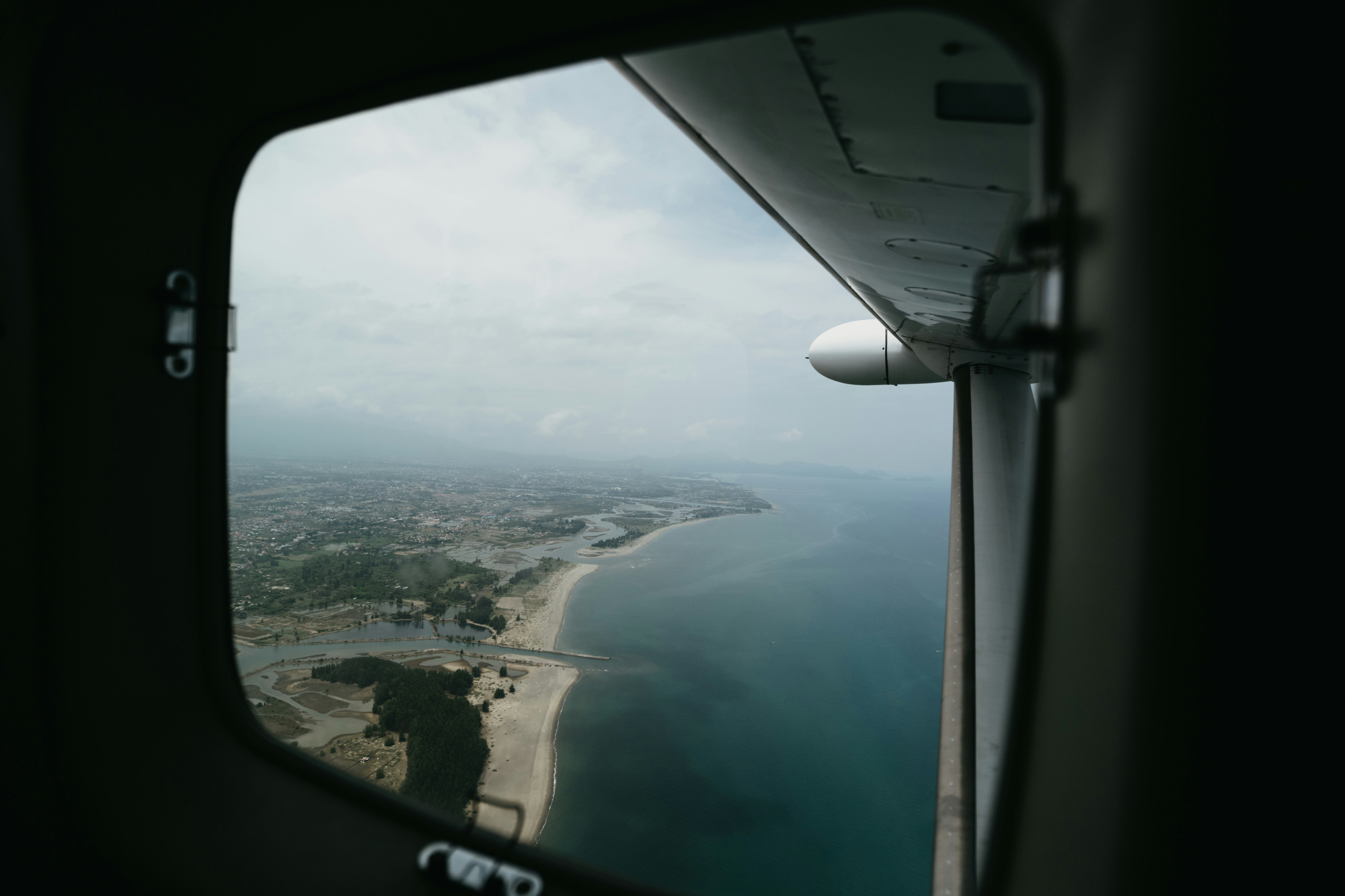 a view of a beach from an airplane window