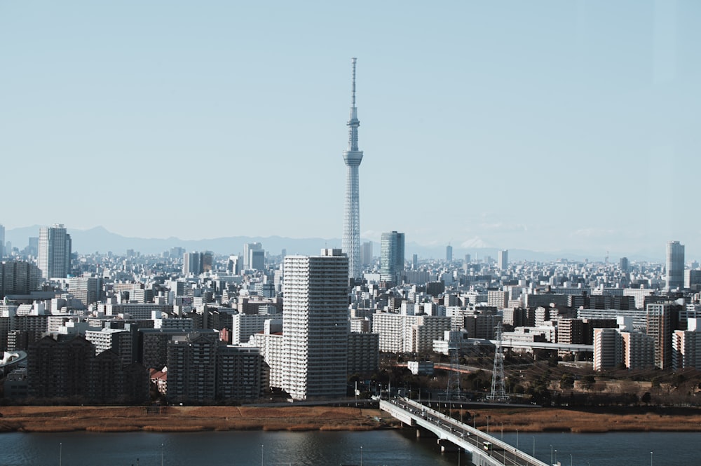 a view of a city with a bridge in the foreground