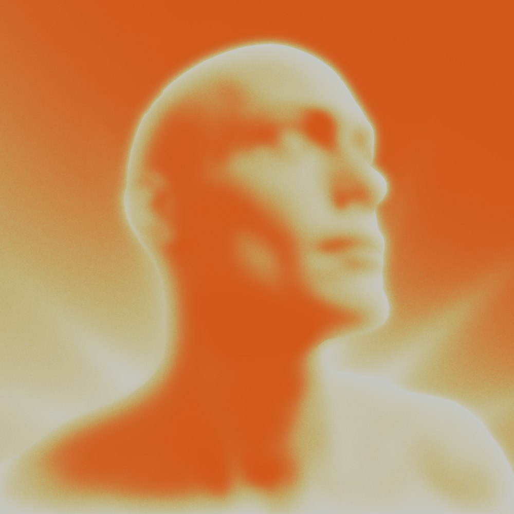 a blurry image of a man's face and neck