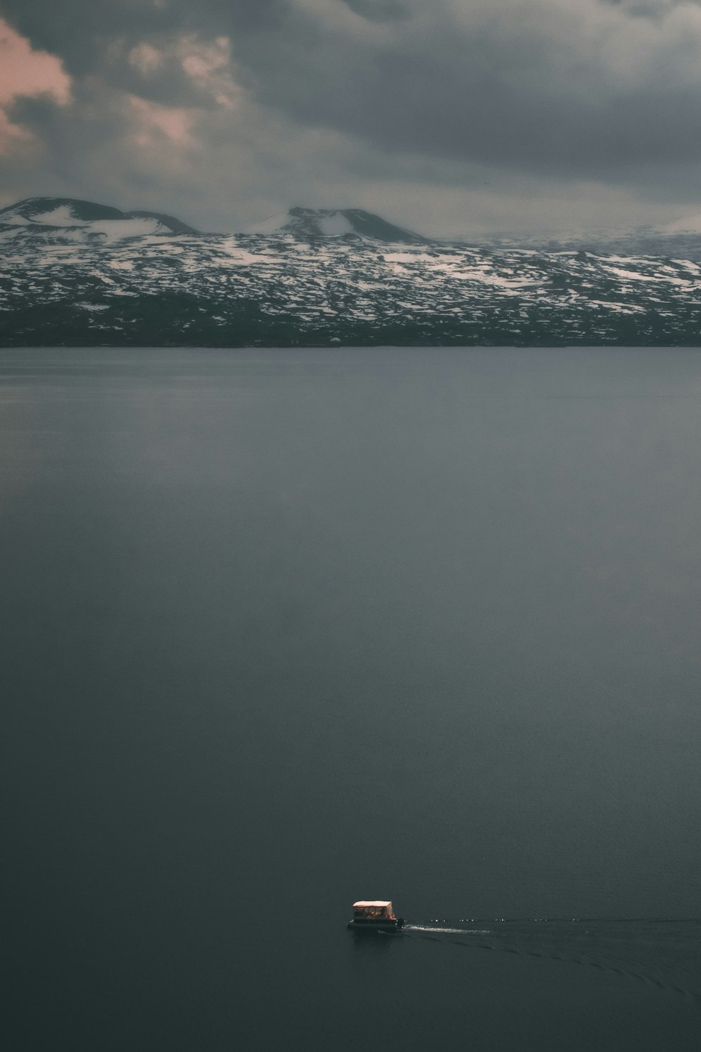 a boat floating on top of a large body of water