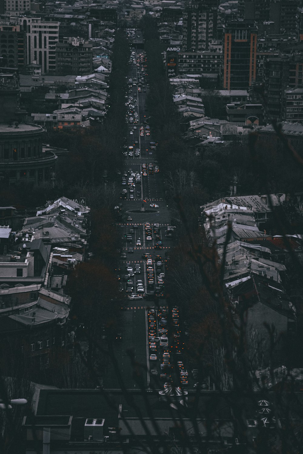 an aerial view of a city with tall buildings