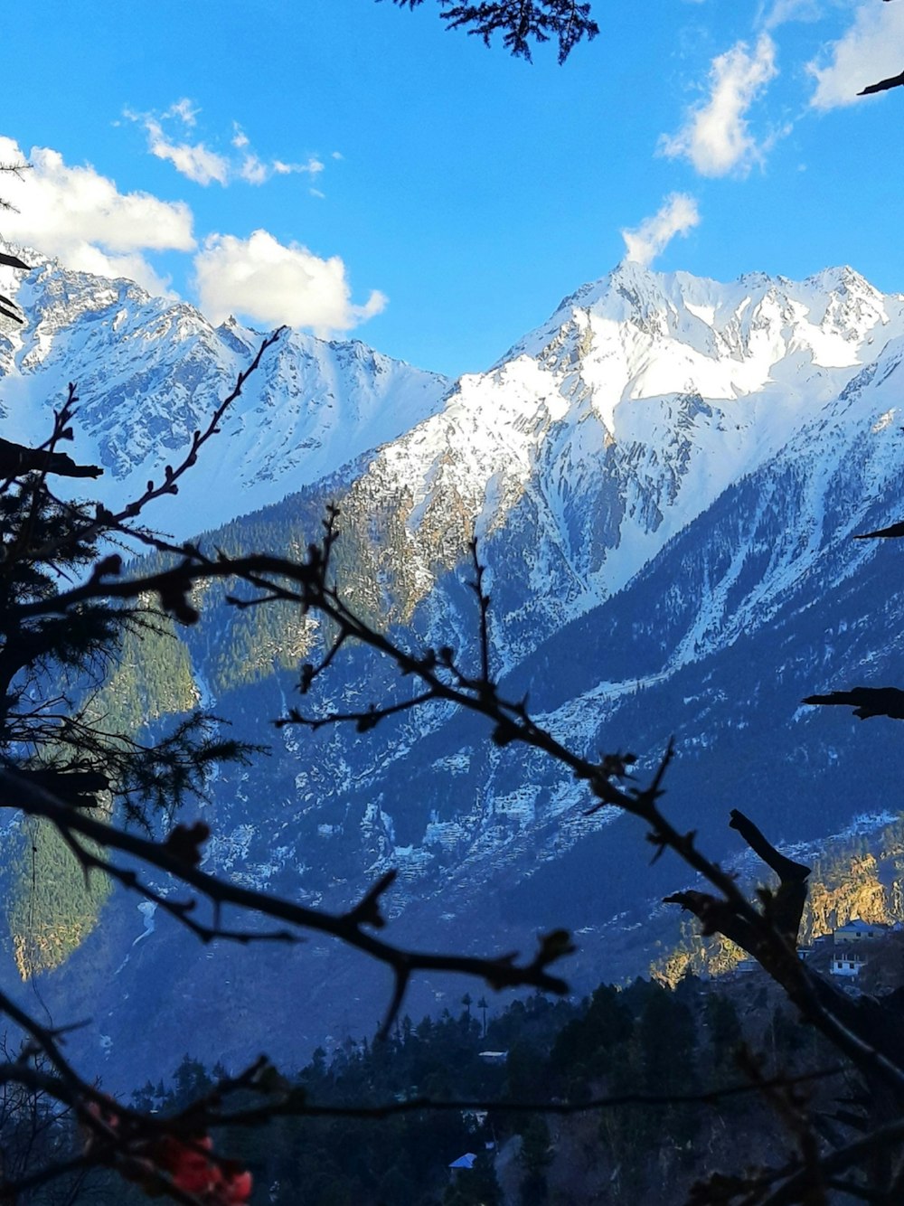 a view of a snowy mountain range from a distance