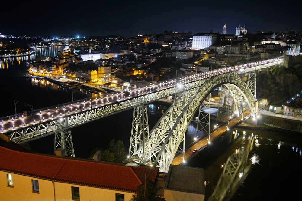 a large bridge over a river at night