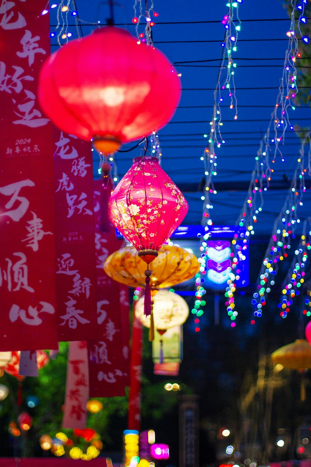 chinese lanterns hanging from the ceiling of a restaurant