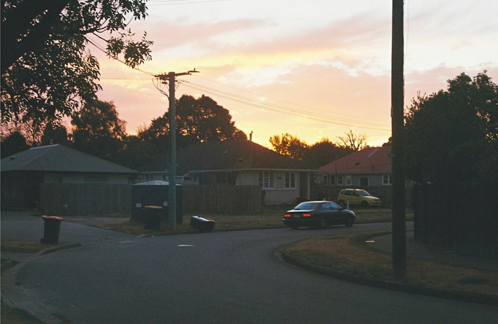 a street with cars parked on the side of it