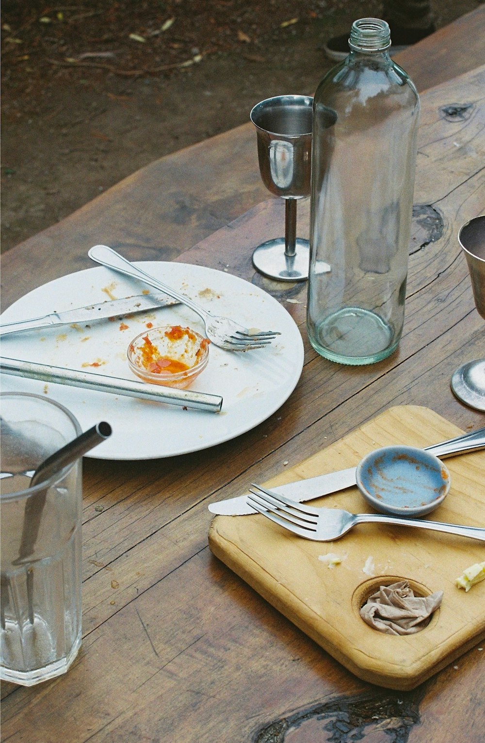 a wooden table topped with a plate of food