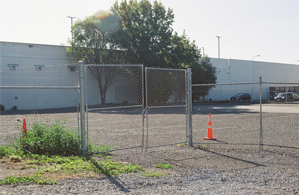 a parking lot with a chain link fence