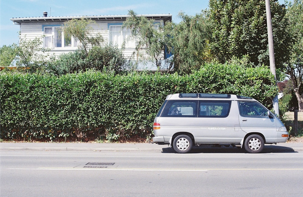 a van is parked on the side of the road