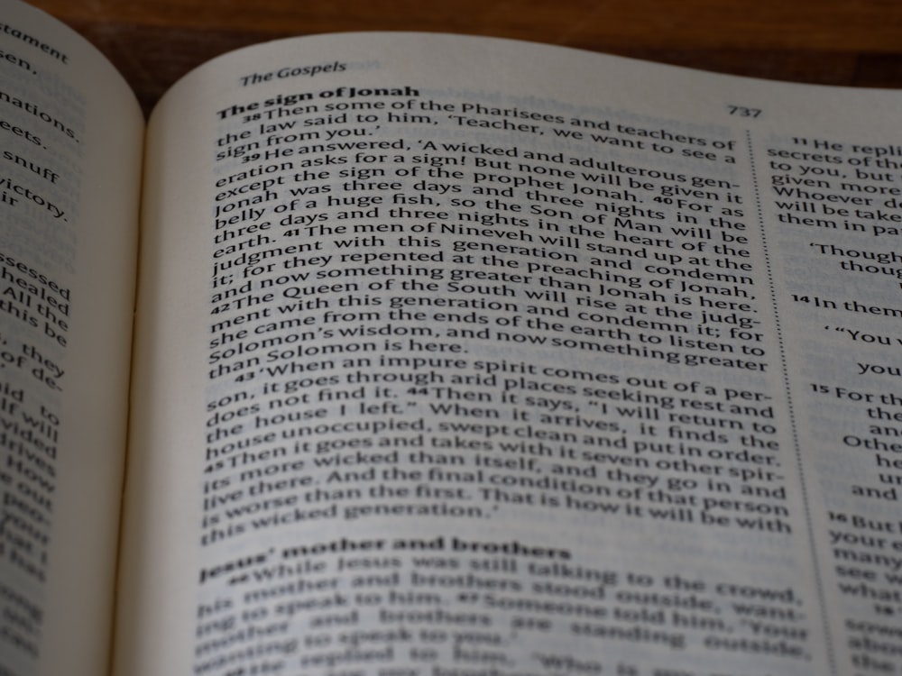 a close up of an open book on a table