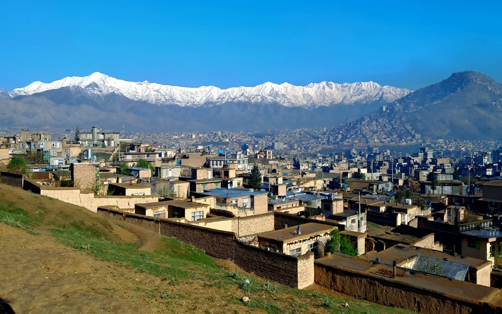 a view of a city with mountains in the background