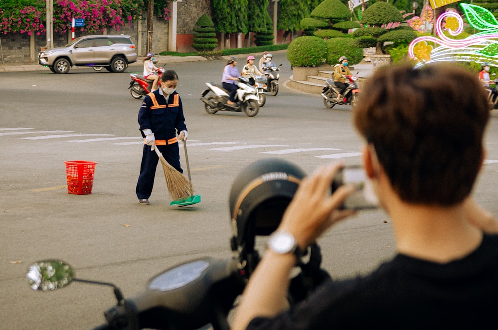 a person on a motorcycle taking a picture