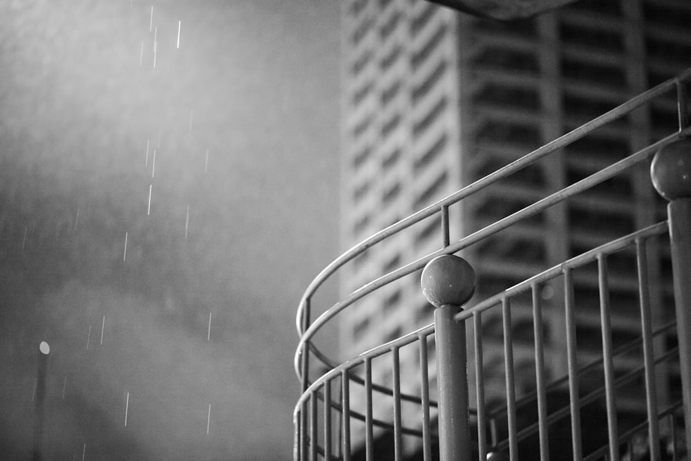 a black and white photo of a spiral staircase