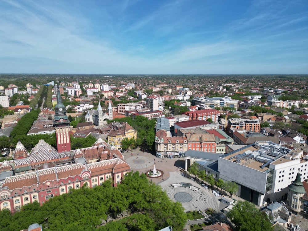 an aerial view of a city with tall buildings