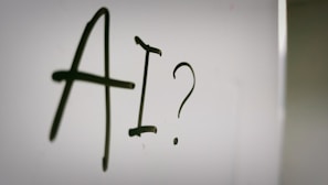 a sign with a question mark and a question mark drawn on it