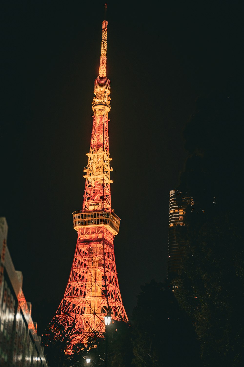the eiffel tower is lit up at night